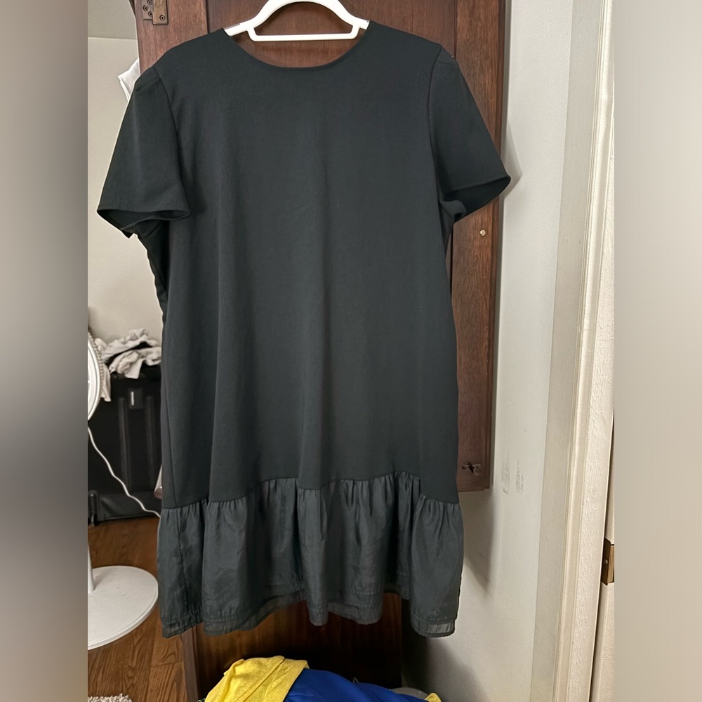 Sweet black T-shirt, dress with a ruffle on the bottom. Casual or dressy.